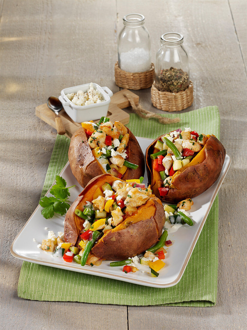 Baked sweet potatoes filled with chicken breast and feta cheese