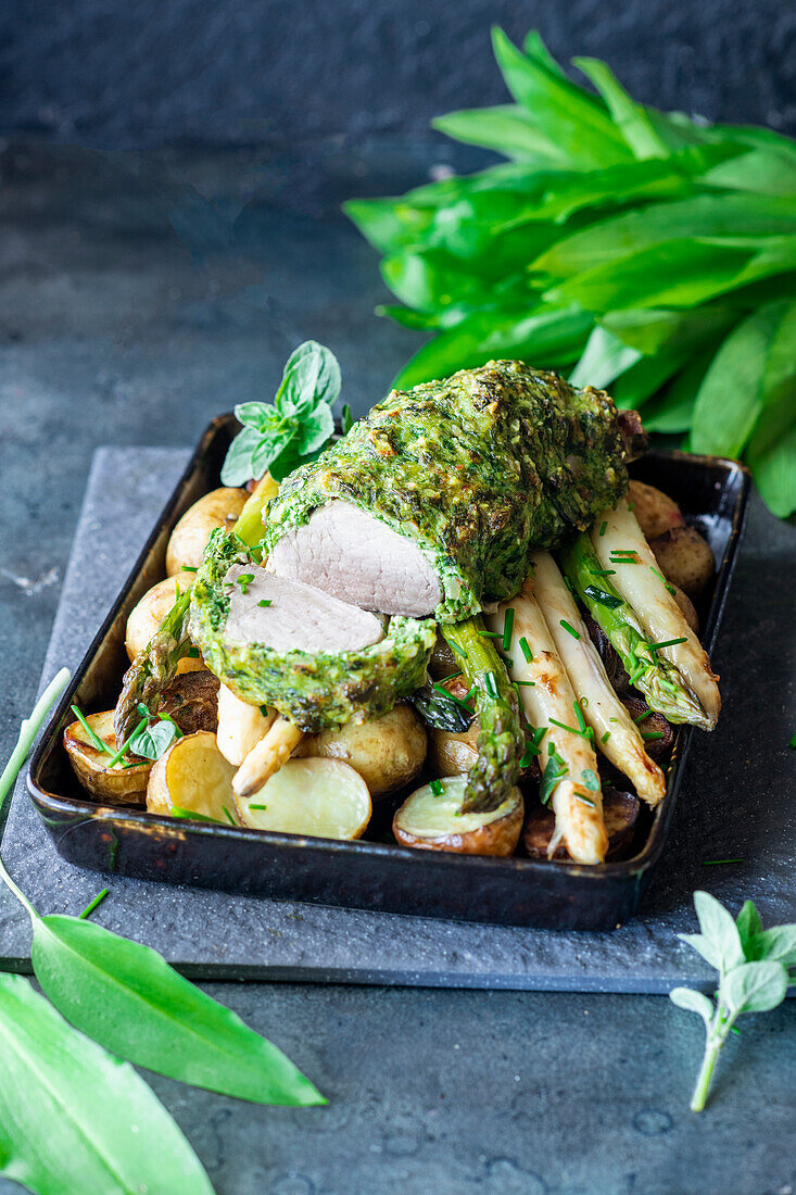 Pork tenderloin with wild garlic crust, asparagus, and potatoes