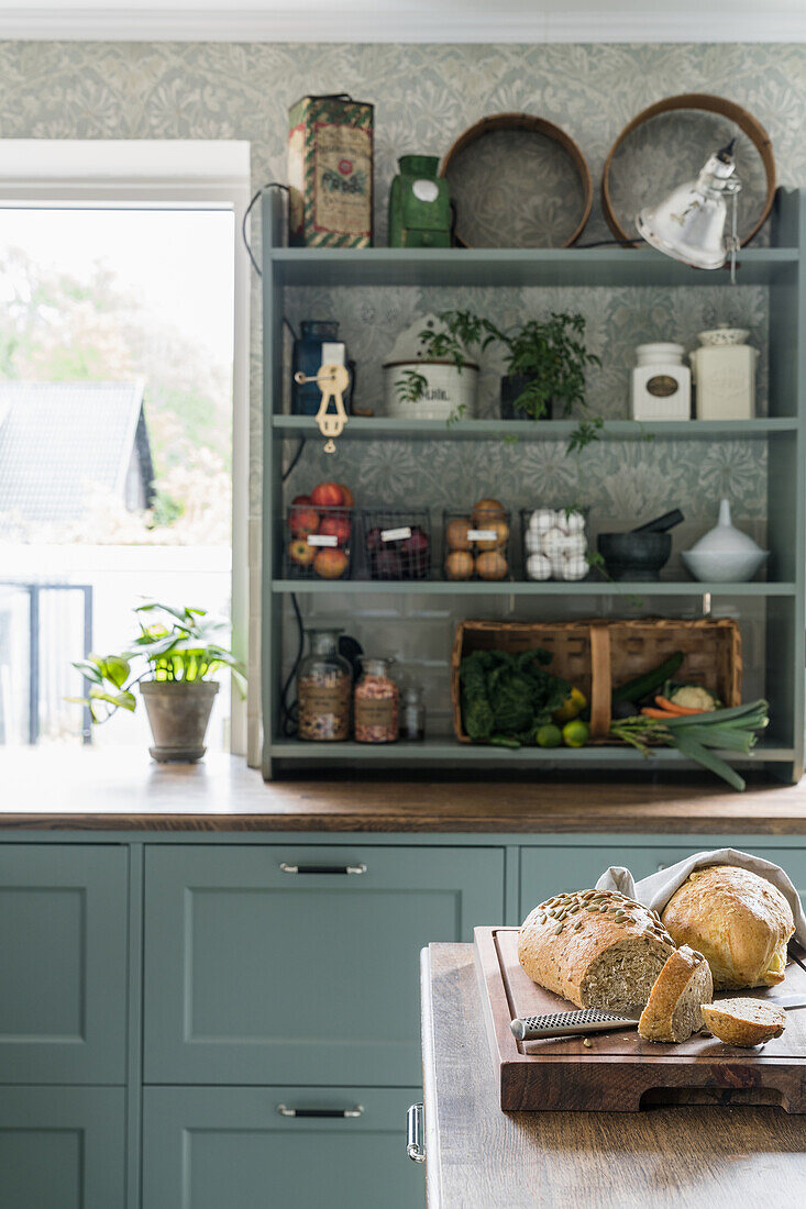 Open shelf above kitchen unit