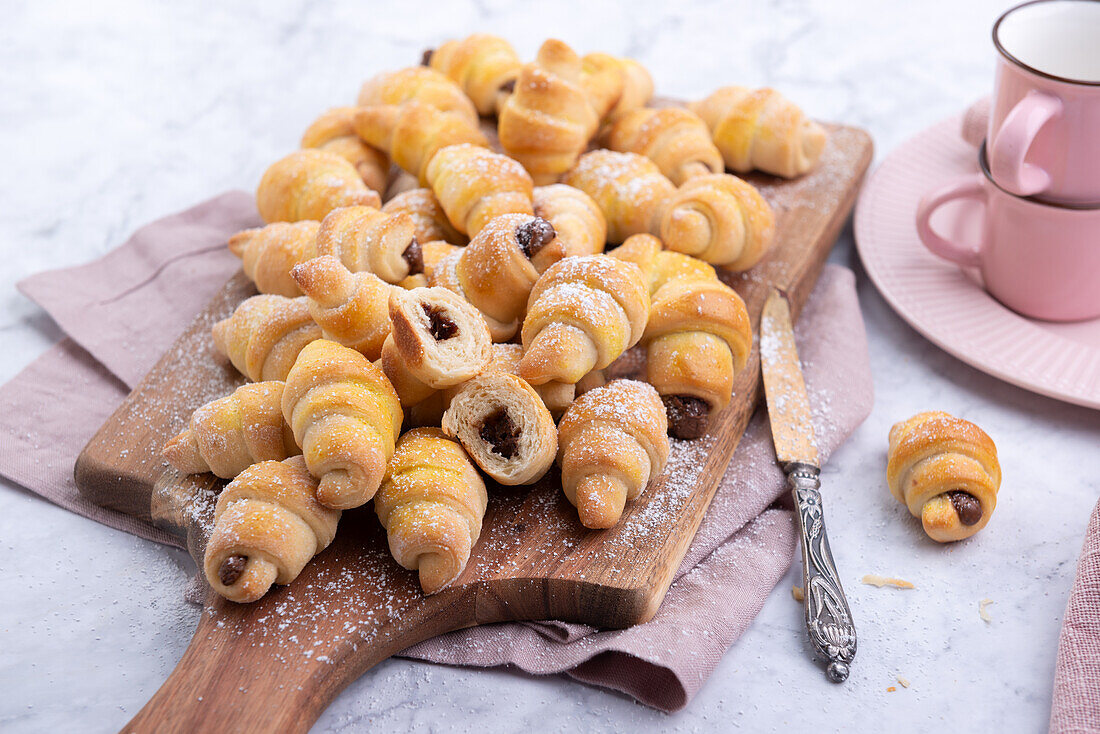 Mini vegan croissants made from yeast dough, filled with chocolate spread