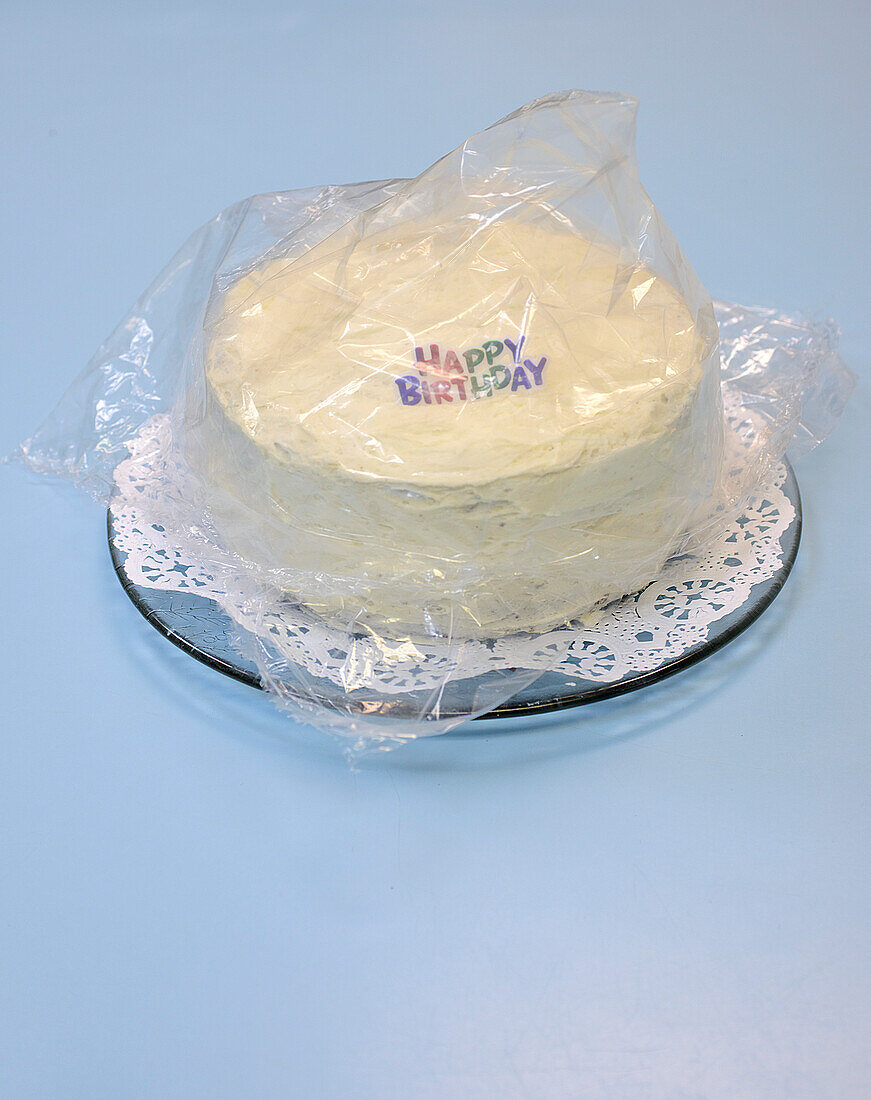 Birthday Cake covered with Plastic Wrapping