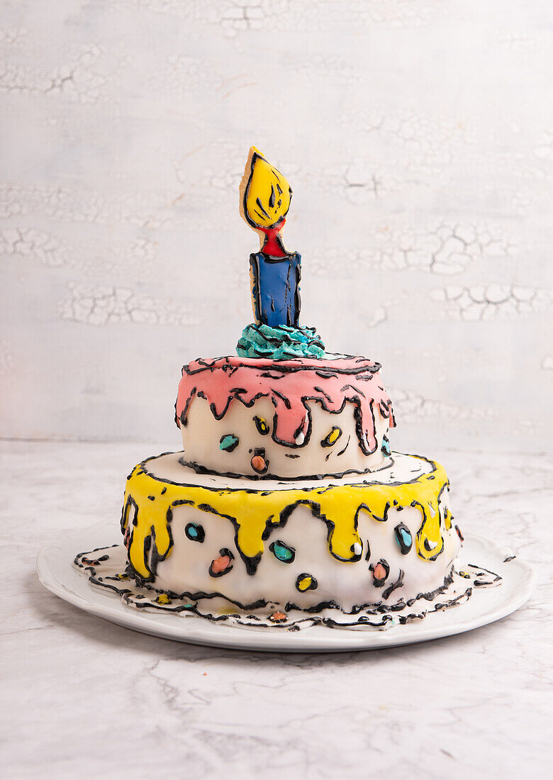 A vegan buttercream cake decorated in a comic style