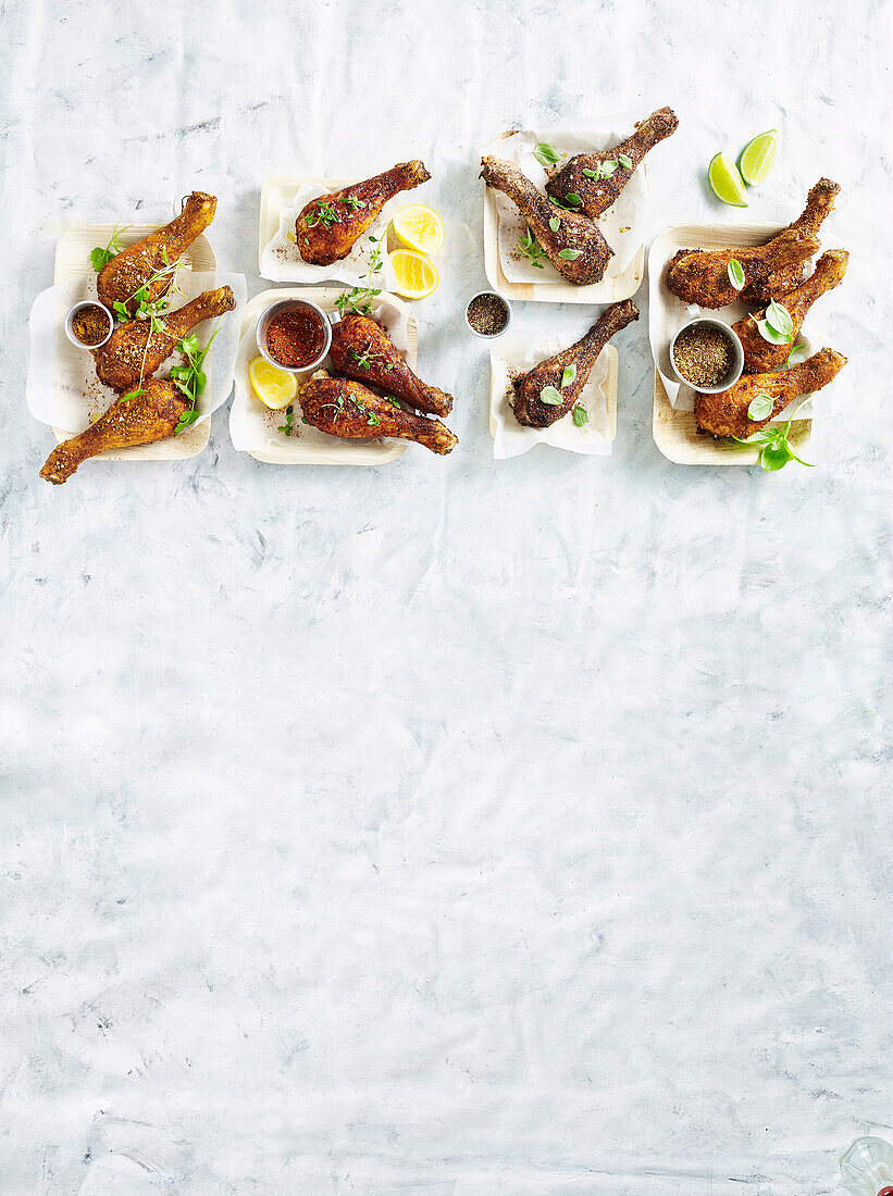 Drumsticks with cajun rub, with sumac rub, with indian-style rub and with smoky spice rub