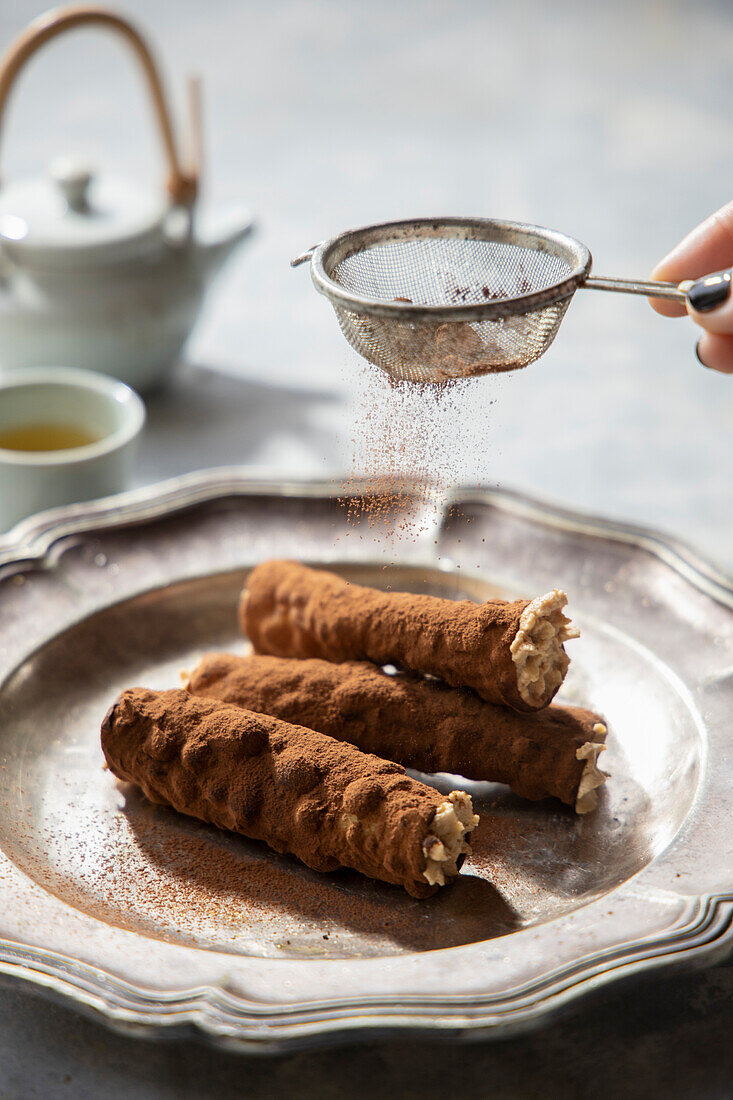 Cocoa cannoli filled with coffee