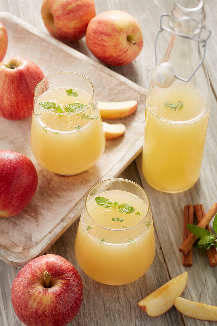 Apple juice in bottles and glasses