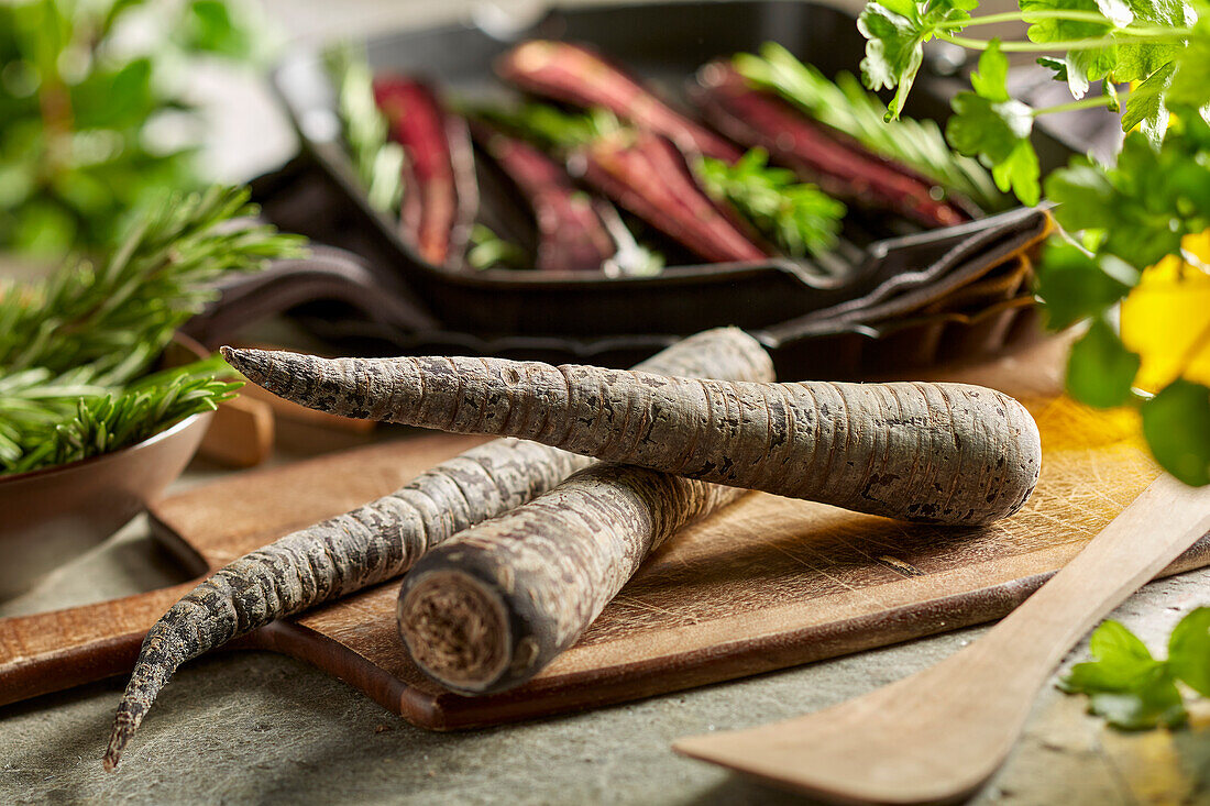 Fresh purple carrots on a cutting board