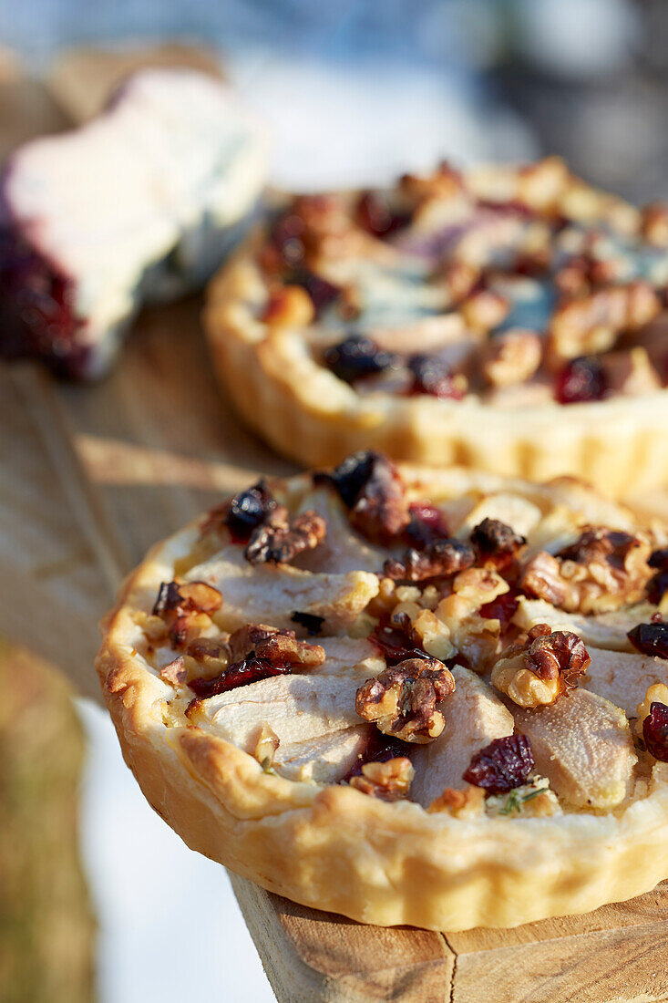 Pear and cheese tartlet with cranberries and walnuts