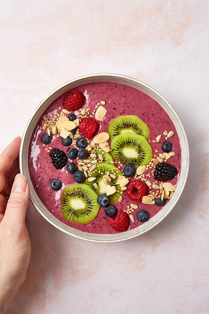 Colourful smoothie bowl with matcha and fruit