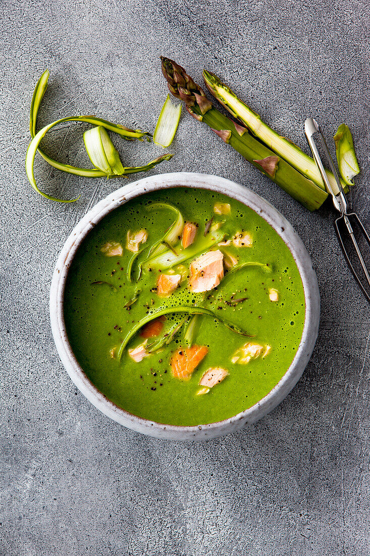 Asparagus and watercress soup with hot smoked salmon and black pepper