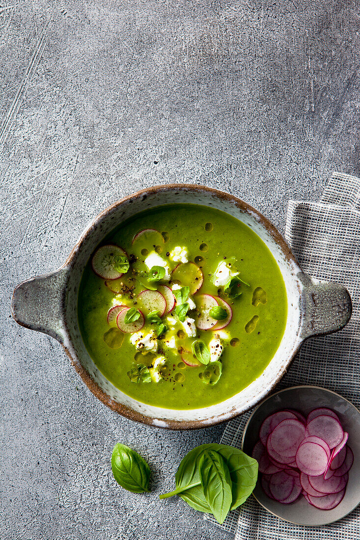 Zucchini and apple soup with feta, finely chopped radish, basil and olive oil