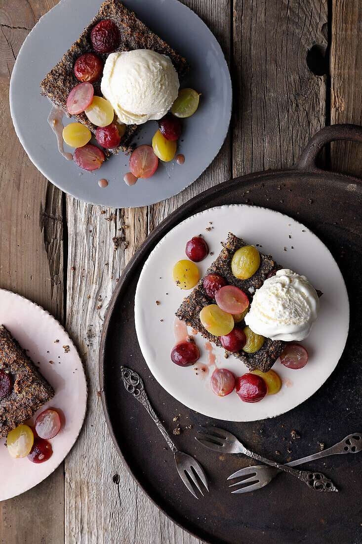 Poppy seed cake with grapes and vanilla ice cream