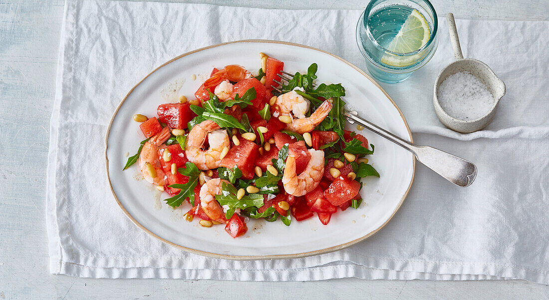 Watermelon and shrimp salad with rocket leaves