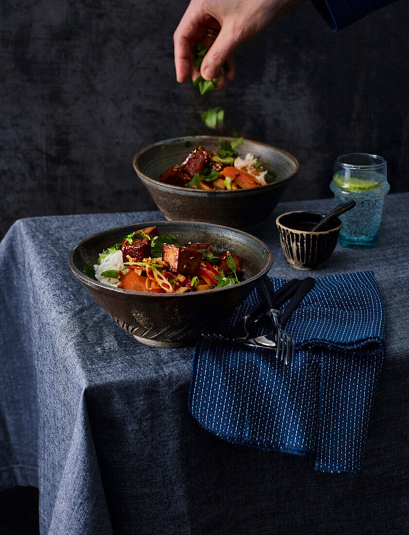 Sticky tofu with stir-fried vegetables and fresh coriander