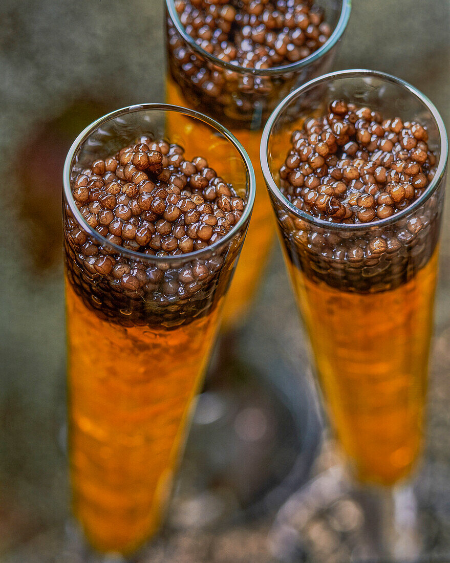 Vodka jelly with caviar served in champagne flutes (Close Up)