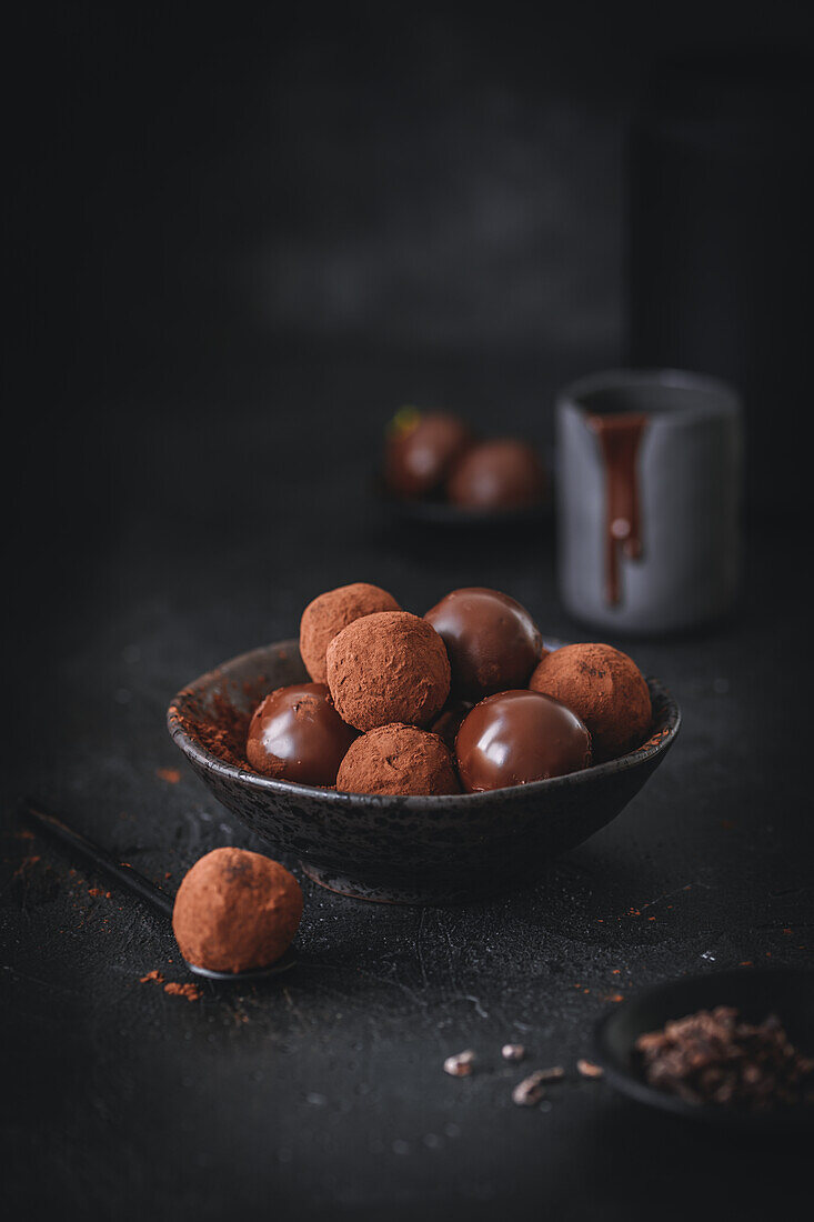 Chocolate truffle pralines with chocolate coating and cocoa powder