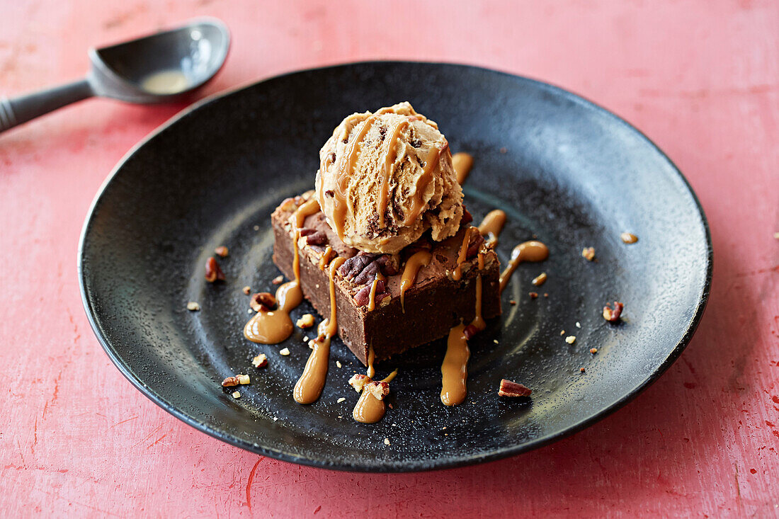 A chocolate brownie with salted caramel ice cream