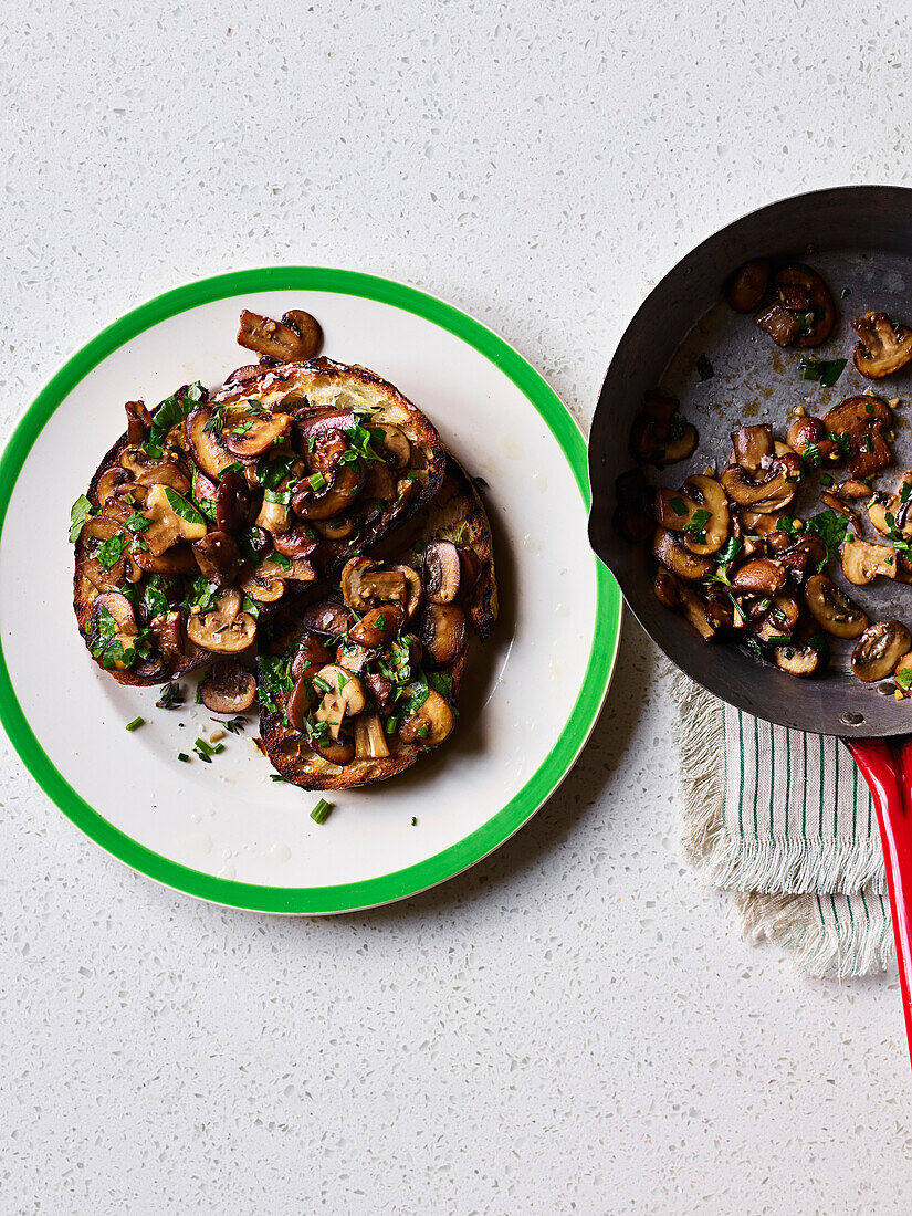 Fried mushrooms with garlic and parsley on toast