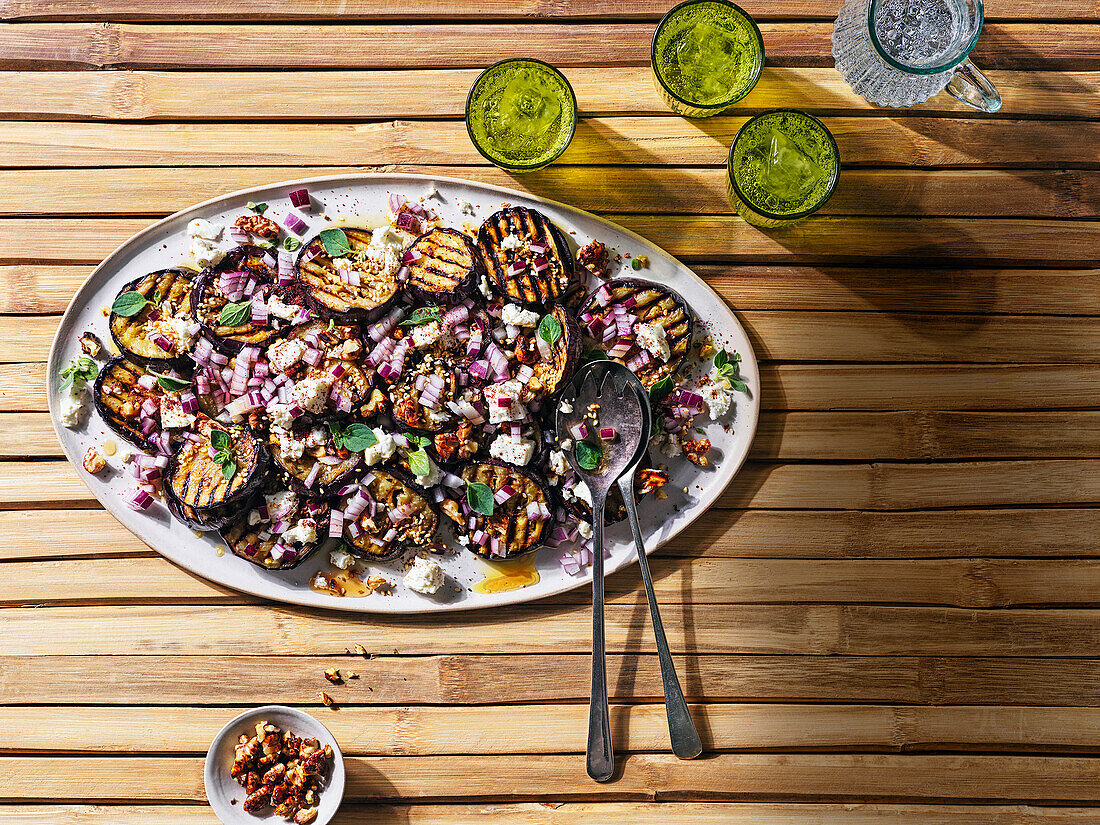 Sweet and sour griddled aubergines with candied walnuts, sumac and red onion
