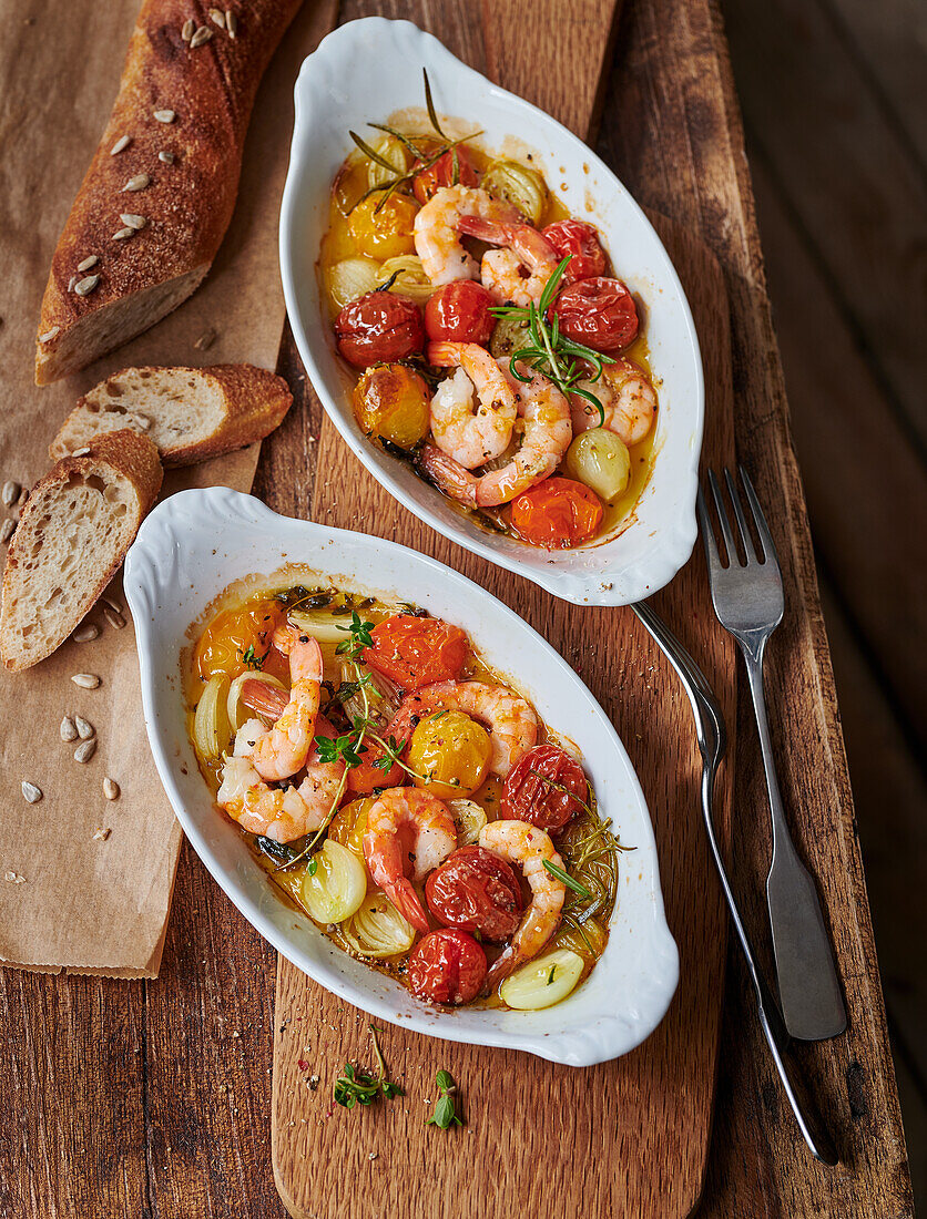 Prawn and tomato dishes with fresh oven baguette