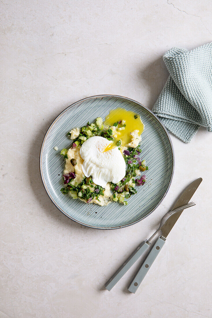 Poached eggs with salsa verde on celeriac puree