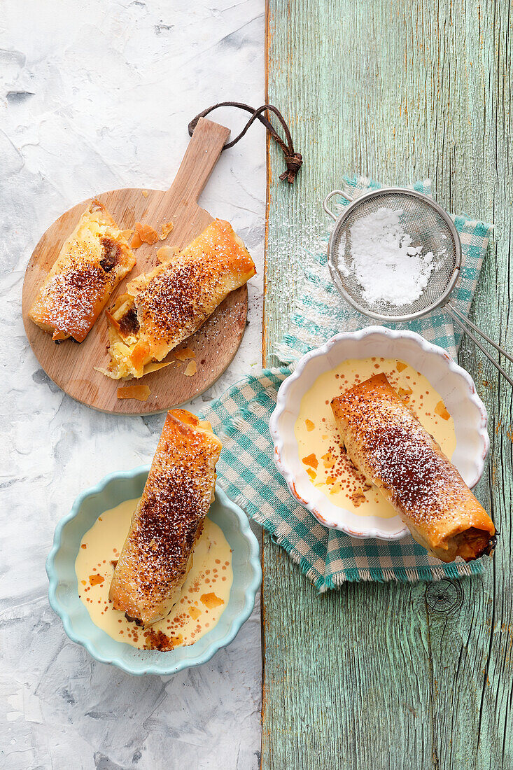 Small tiramisu apple strudel with vanilla sauce