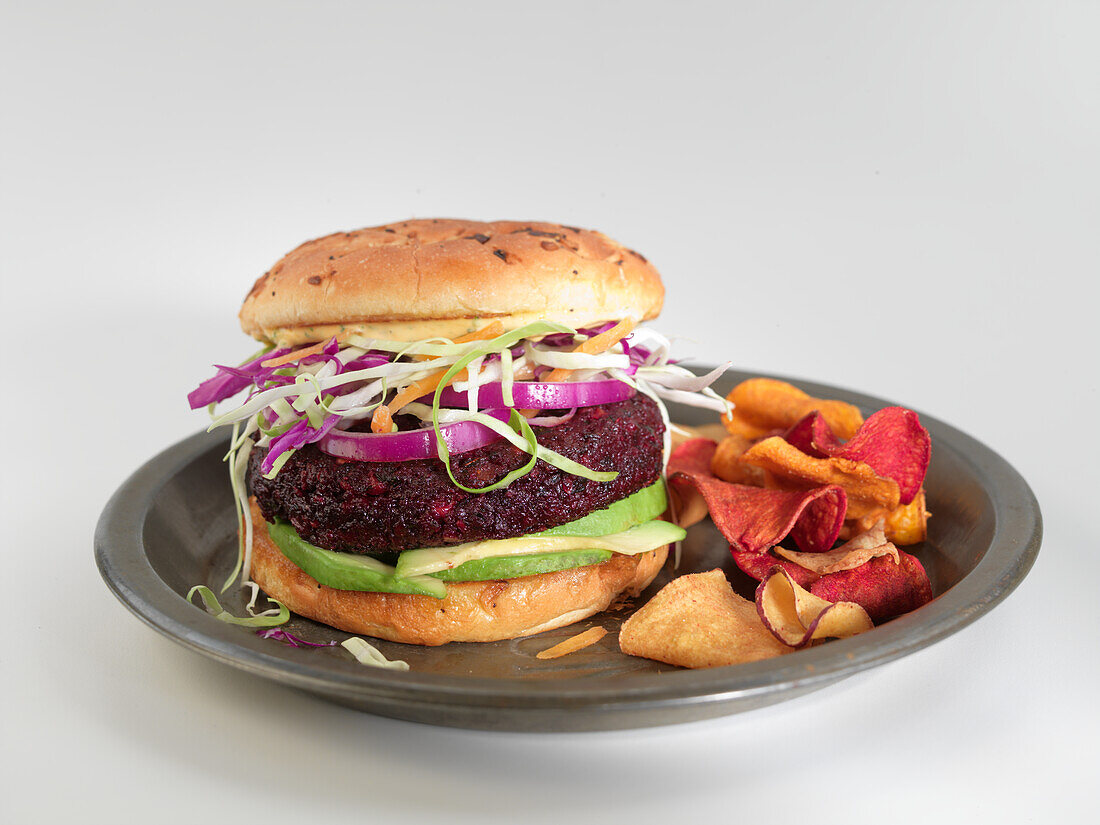 A beetroot burger with vegetable chips