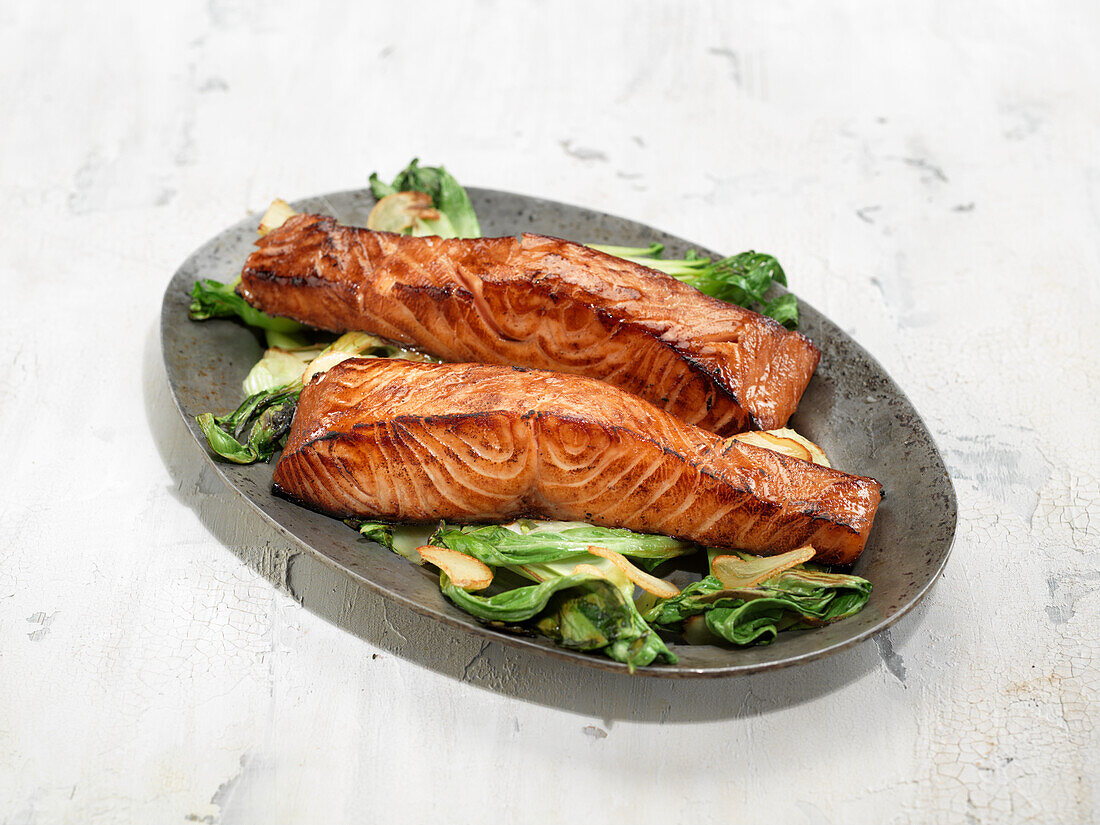 Grilled salmon on a bed of vegetables