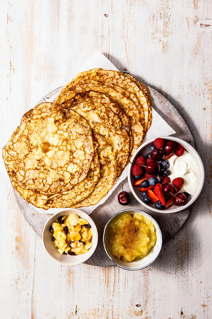 Breakfast pancakes, served with berries and greek yogurt