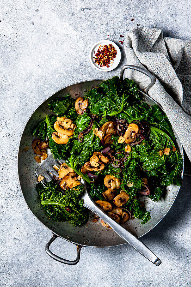 Garlic kale with mushrooms and onions