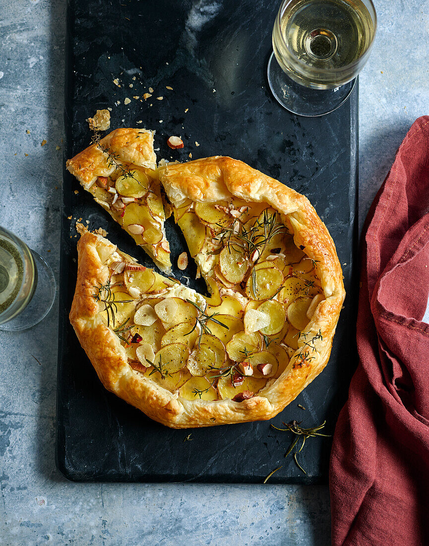 French potato galette with sour cream, almonds, and rosemary