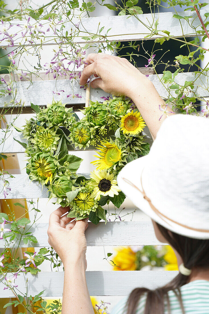 Heart made from sunflower blossoms and buds