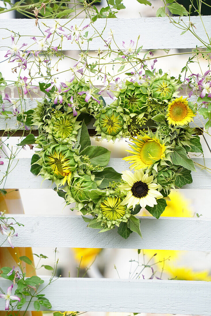 Heart made from sunflower blossoms and buds