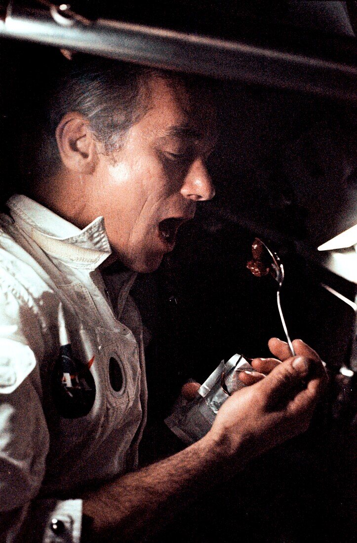 Astronaut Cernan eating a meal in space