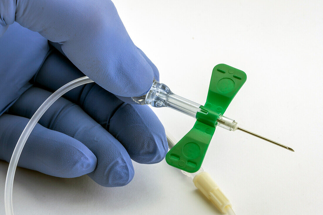 Nurse holding an IV catheter