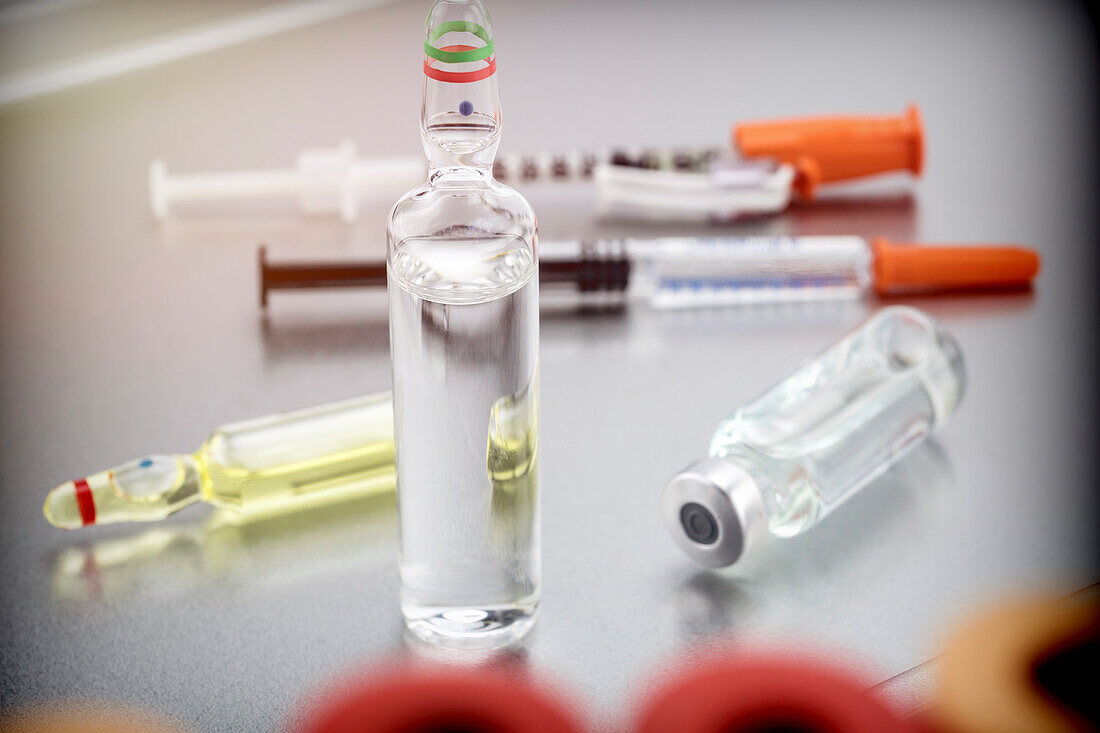 Medicine in vials and syringe, conceptual image