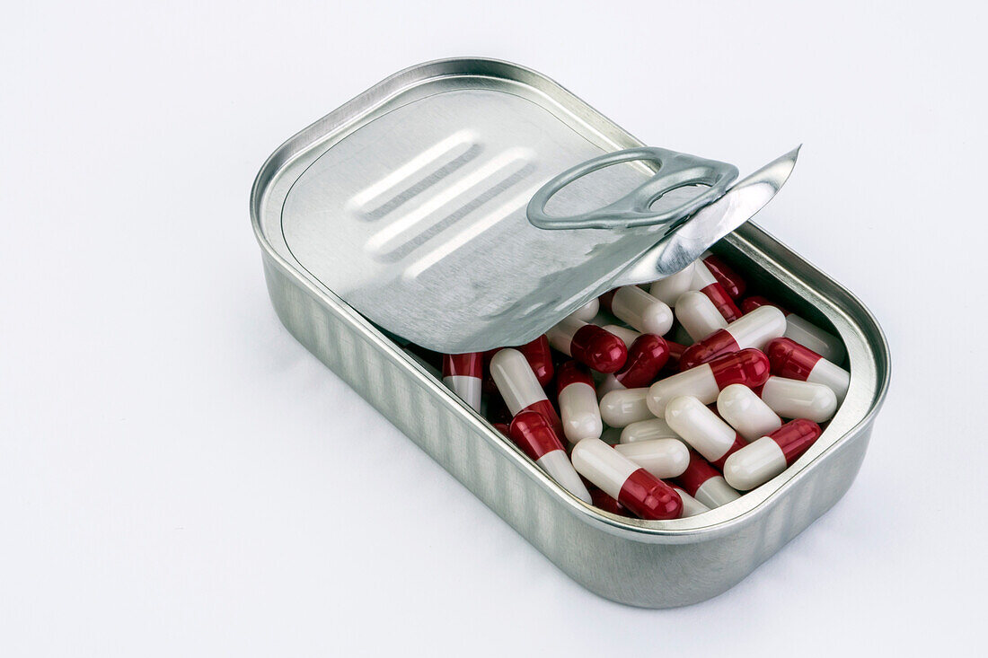 Tin metal containing white and red pills