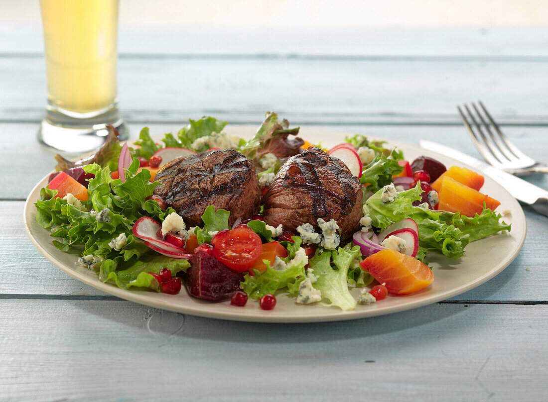 Grilled steak on salad with beetroot and yellow beetroot