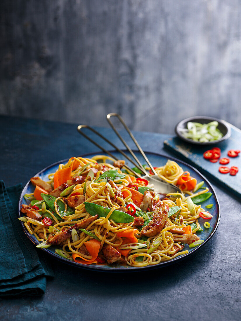 Asian egg noodle salad with chicken and vegetables