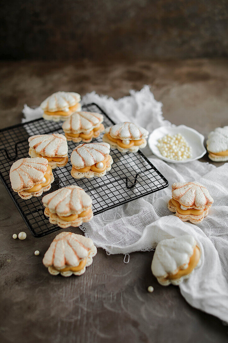 French macarons in shell shape, with caramel cream