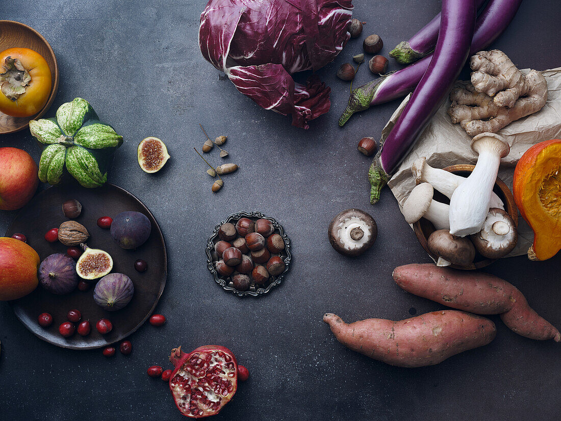 Top view seasonal groceries, healthy vegetarian ingredients on a dark background