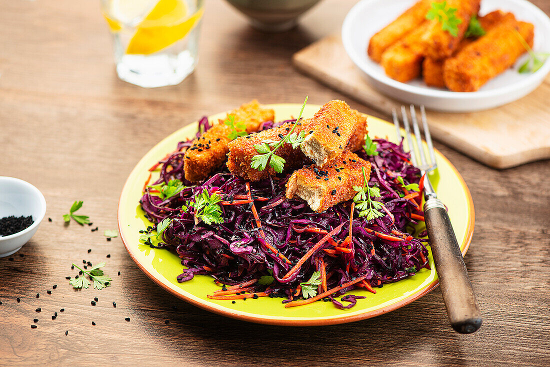 Red cabbage salad with breaded tofu