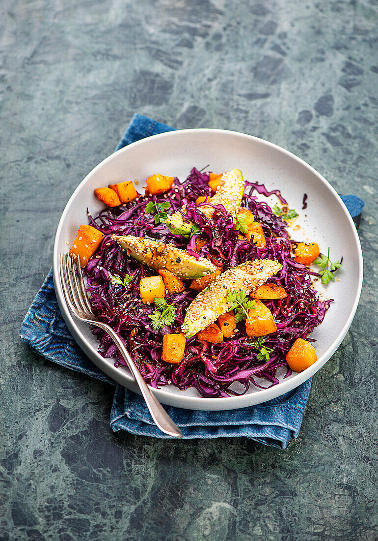 Red cabbage salad with pumpkin and avocado