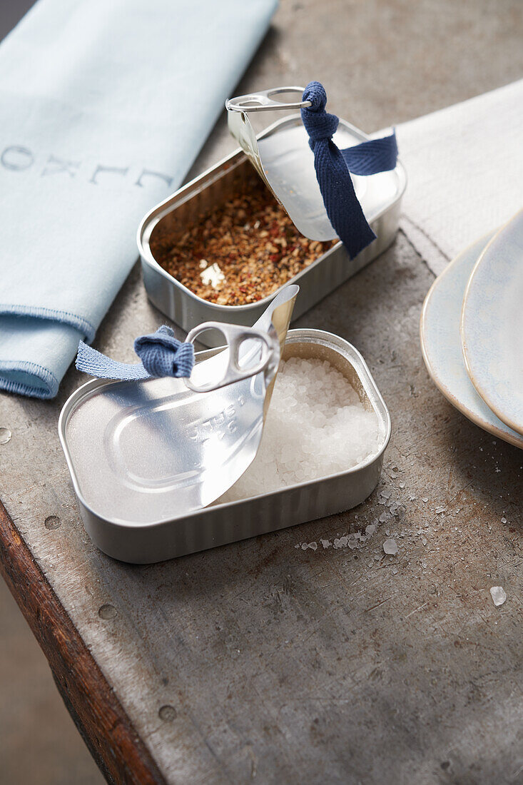 Upcycling idea - decorated anchovy tins as spice jars