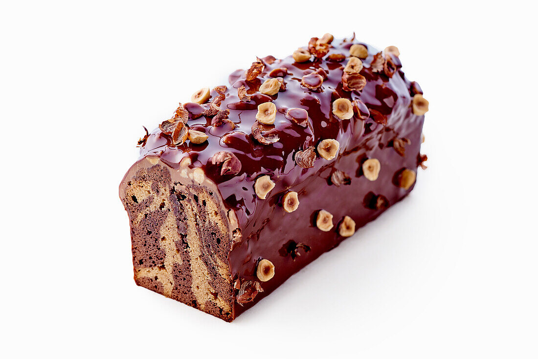 Marble cake with chocolate glaze and nuts