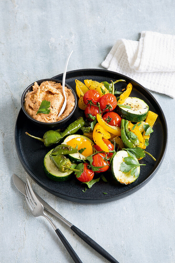 Summery oven vegetables with hummus