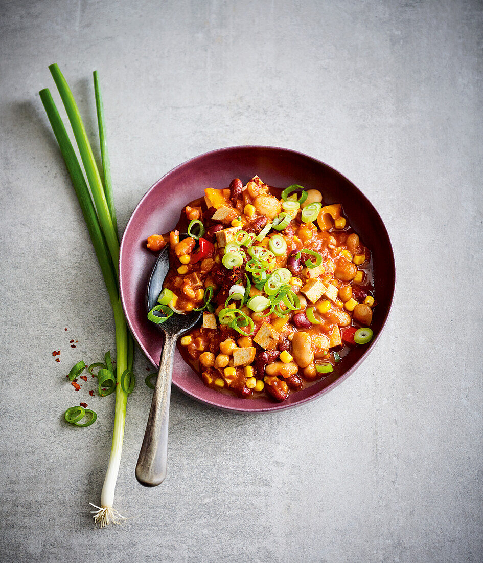 Vegan chili con tofu with beans and corn