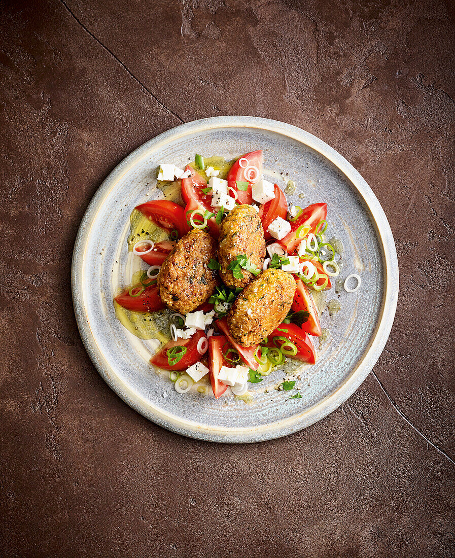 Oat meatballs with tomato and feta salad