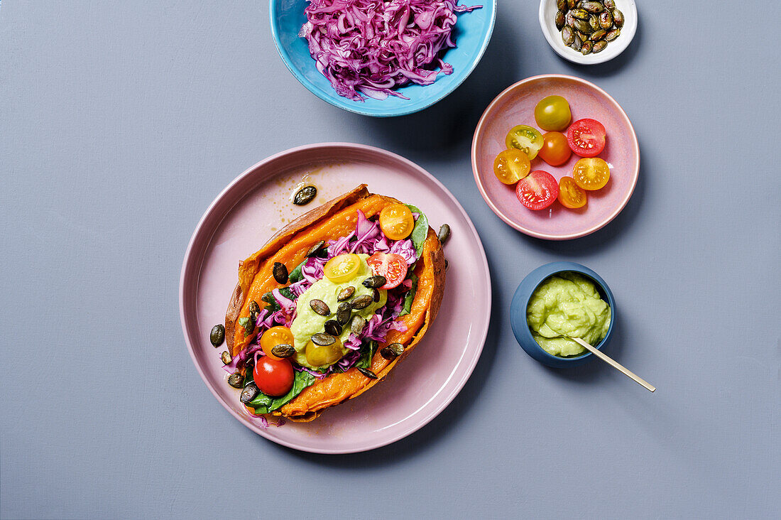 Stuffed sweet potatoes with red cabbage and avocado dip