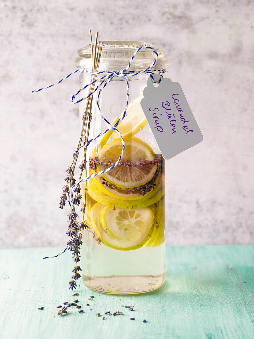 Homemade lavender flower syrup with lemon slices