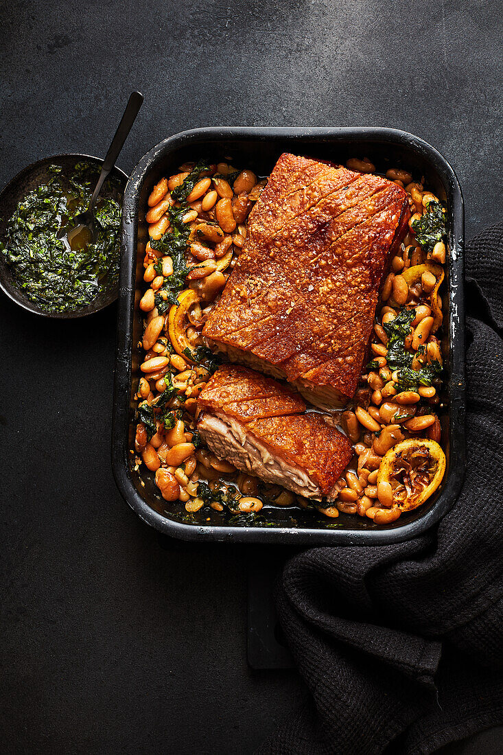 Roasted pork belly with beans and pistou